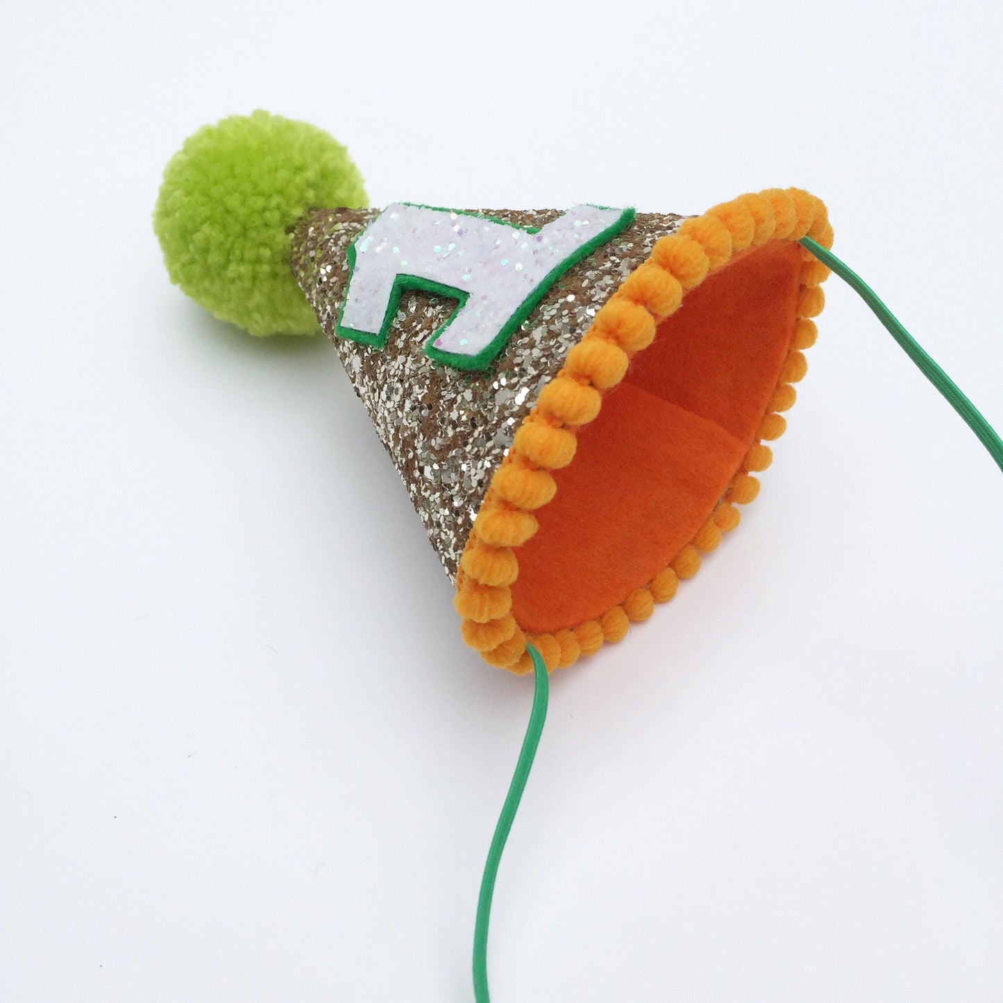Gold and green cone hat with orange trim