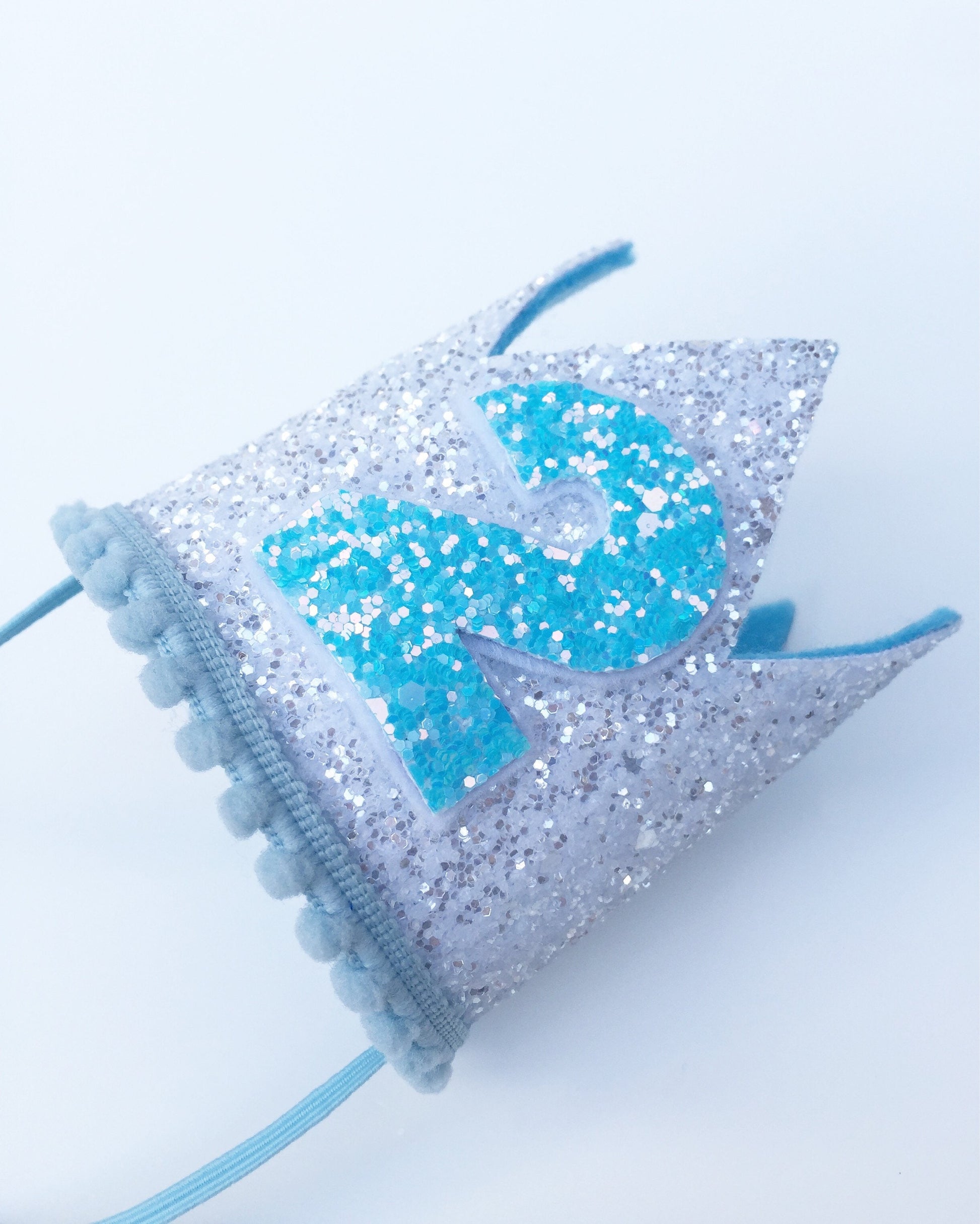White and blue birthday party crown 
