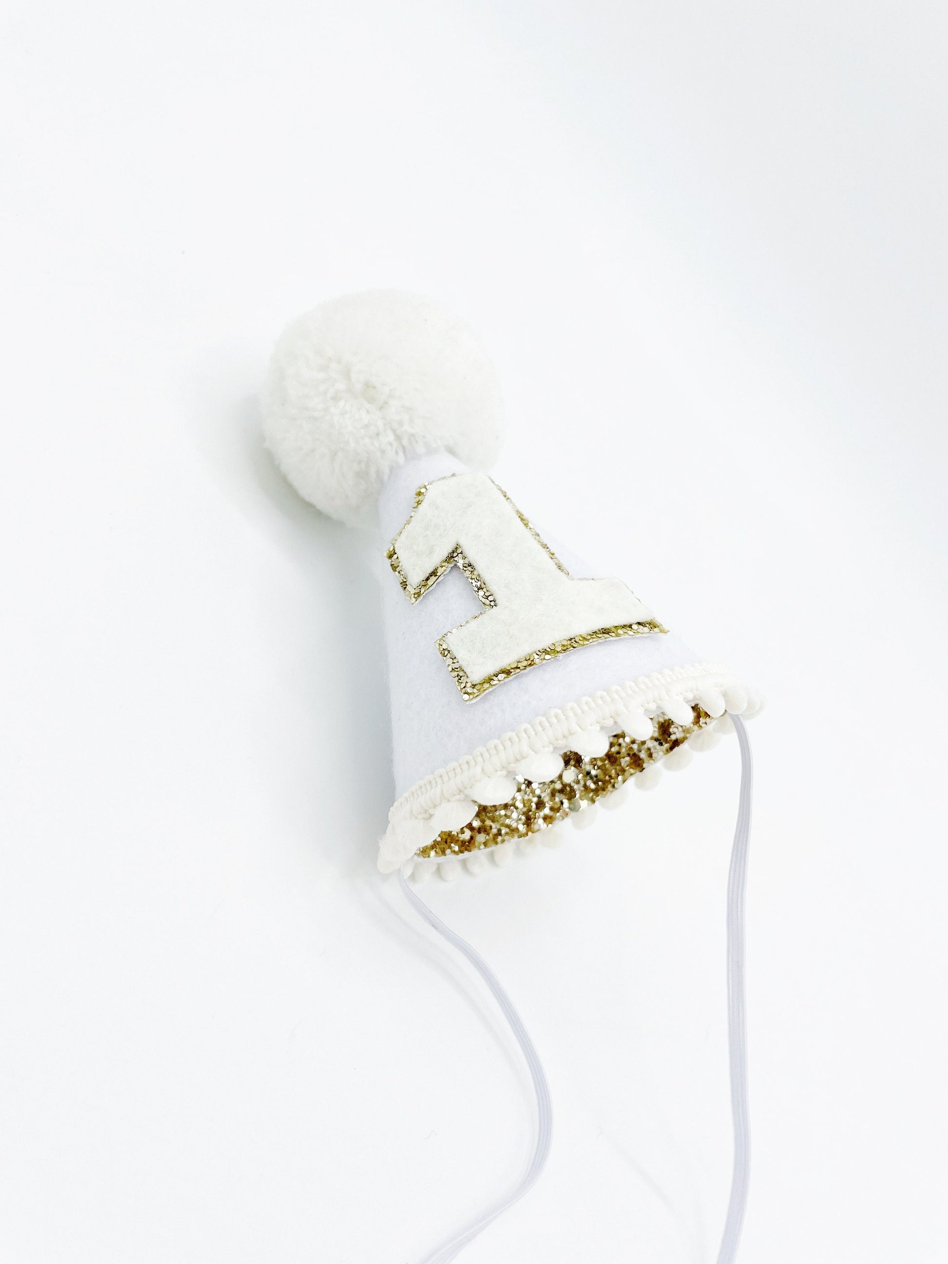 White felt with gold glitter lining cone hat
